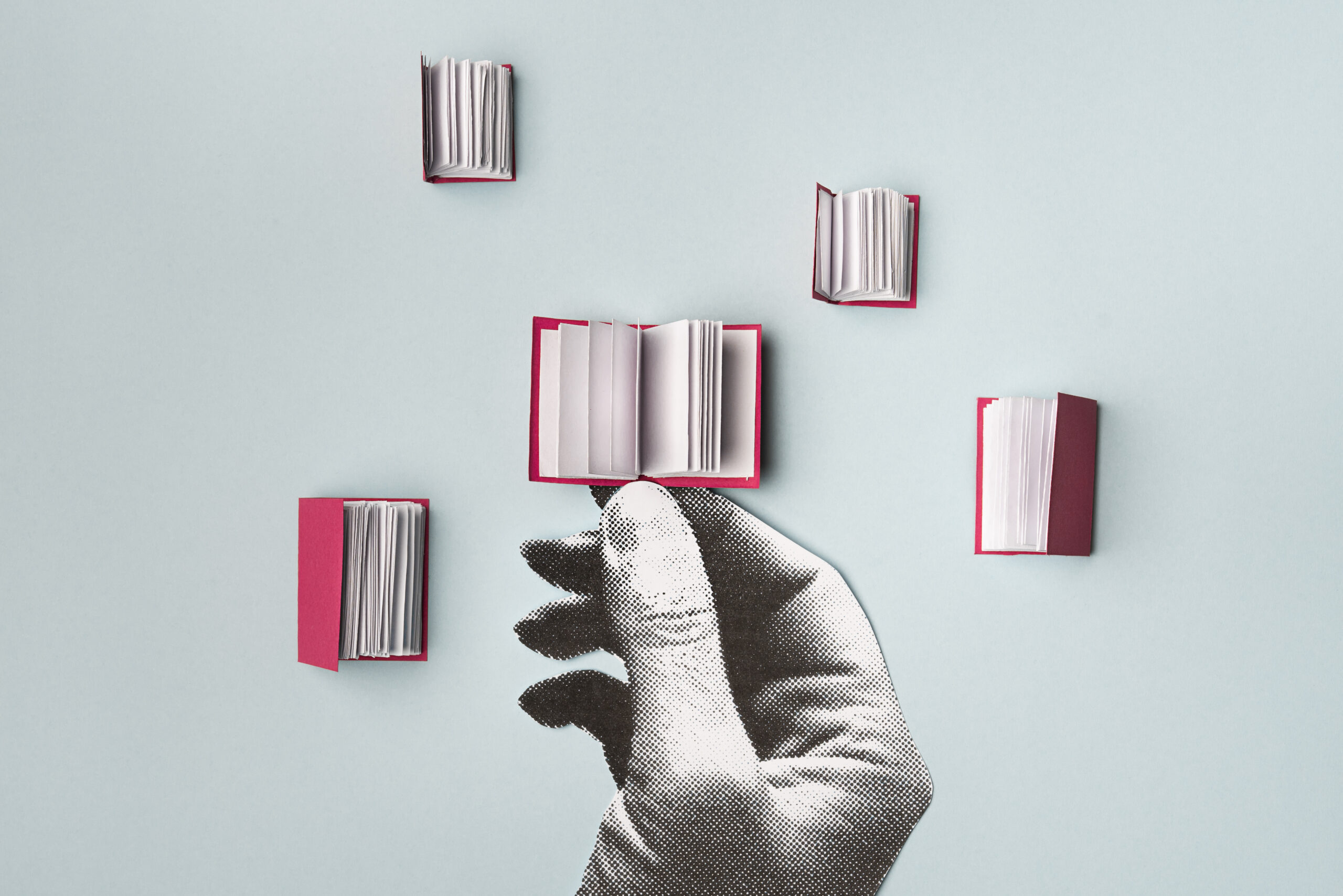 Hand holding a book. Stock illustration of a books with a collage hand